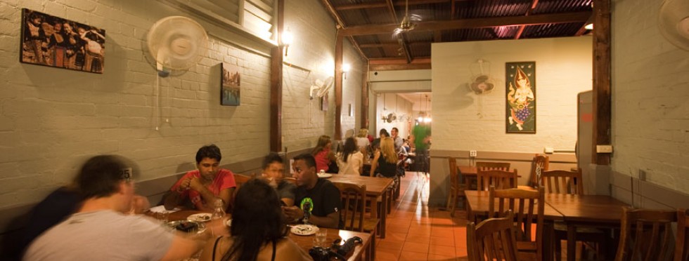 Contact Doytao Thai Newtown. A picture of the interior of Doytao Newtown with people sitting and enjoying their food.